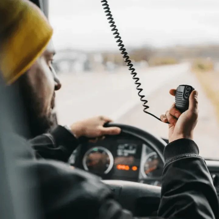 Driver on the highway using the truck radio