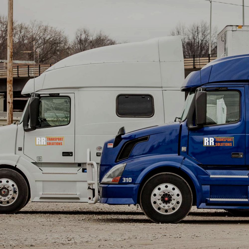 RR Transport Solutions trucks parked in the yard